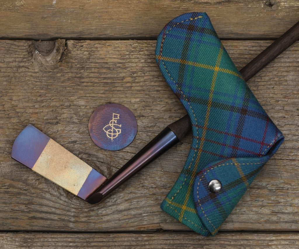 A WALNUT HAND FORGED PUTTER
